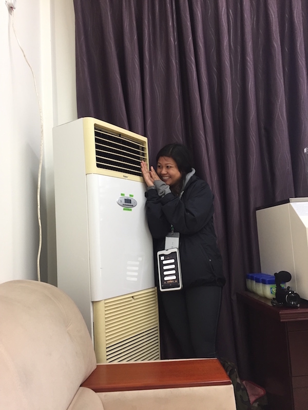 Gigi warming up next to the heater in our office 